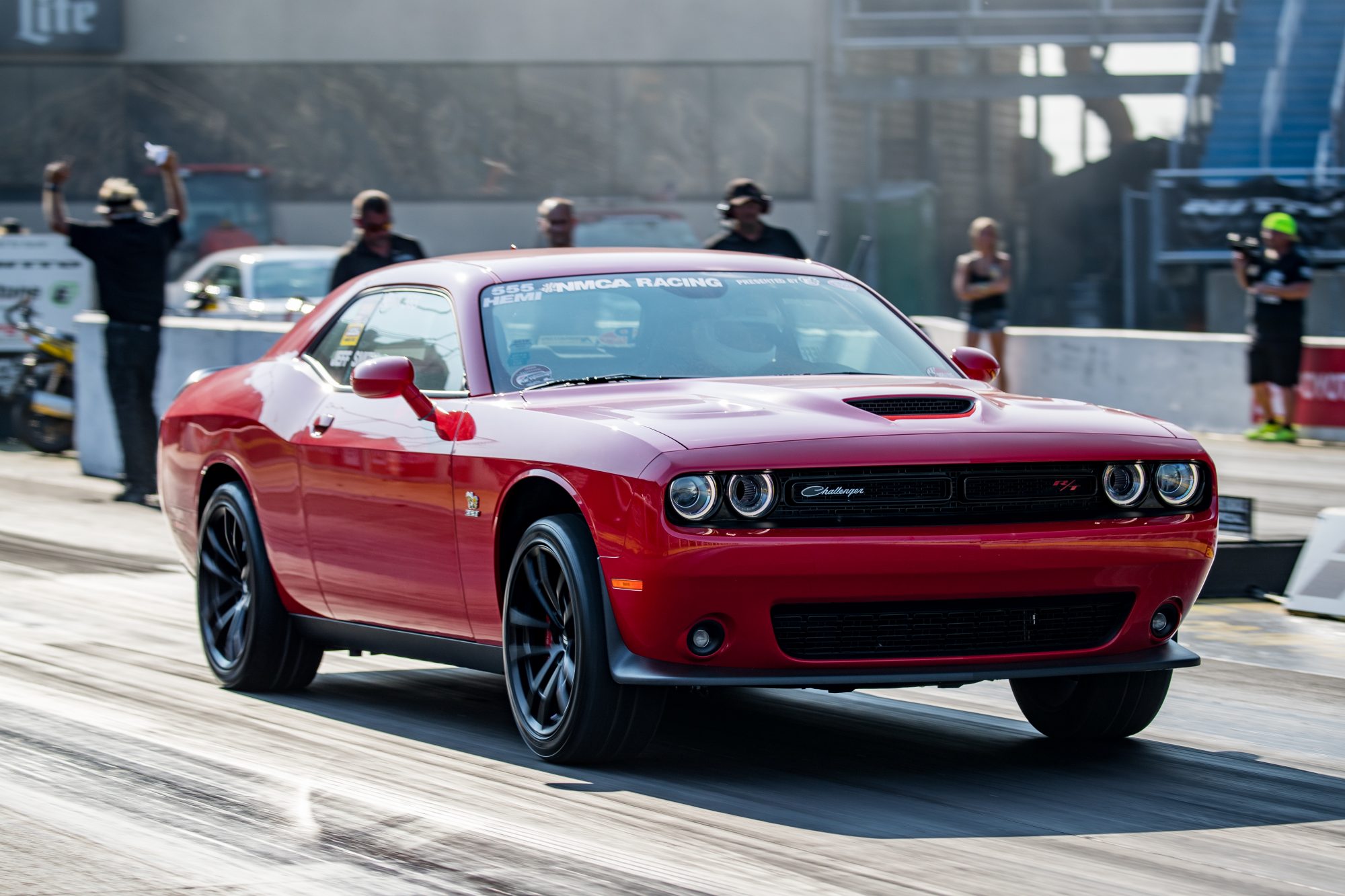 dodge vehicle on the starting line of a drag strip