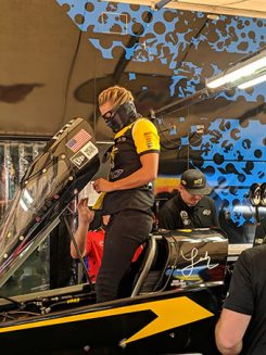 leah pritchett working on her top fuel dragtser