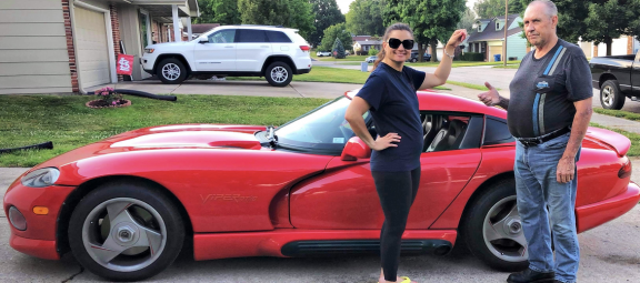 man and woman in front of a Viper
