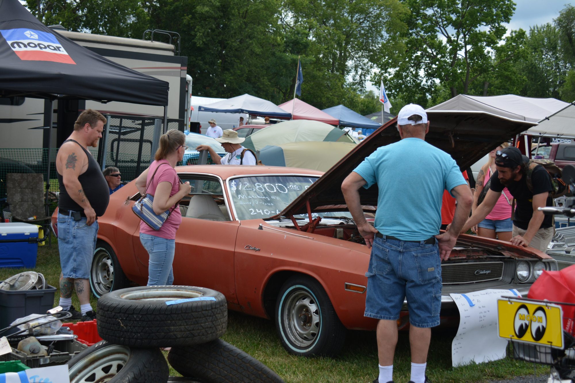 Spectators looking at a vehicle on display