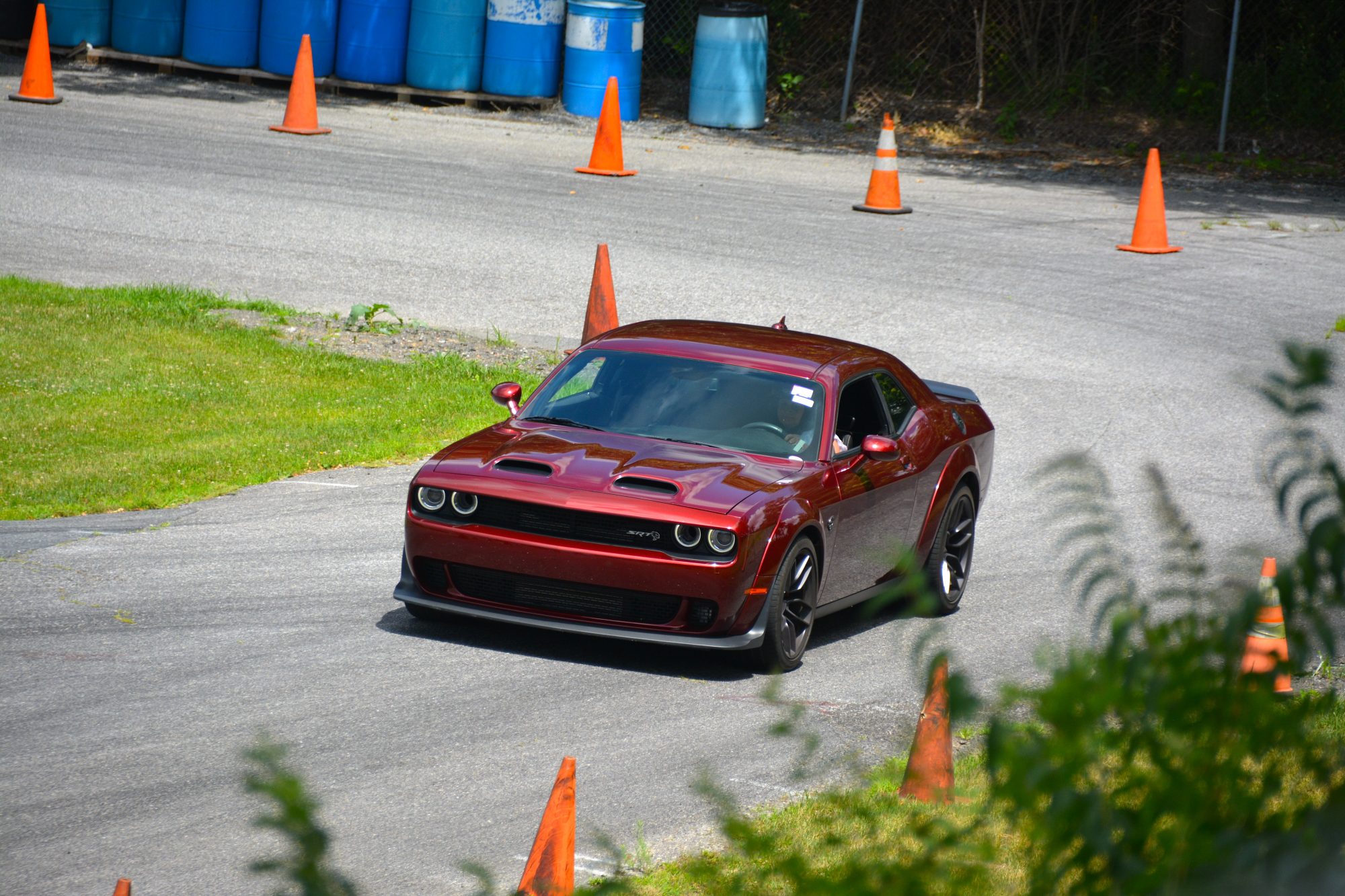 Dodge Challenger driving down a road course