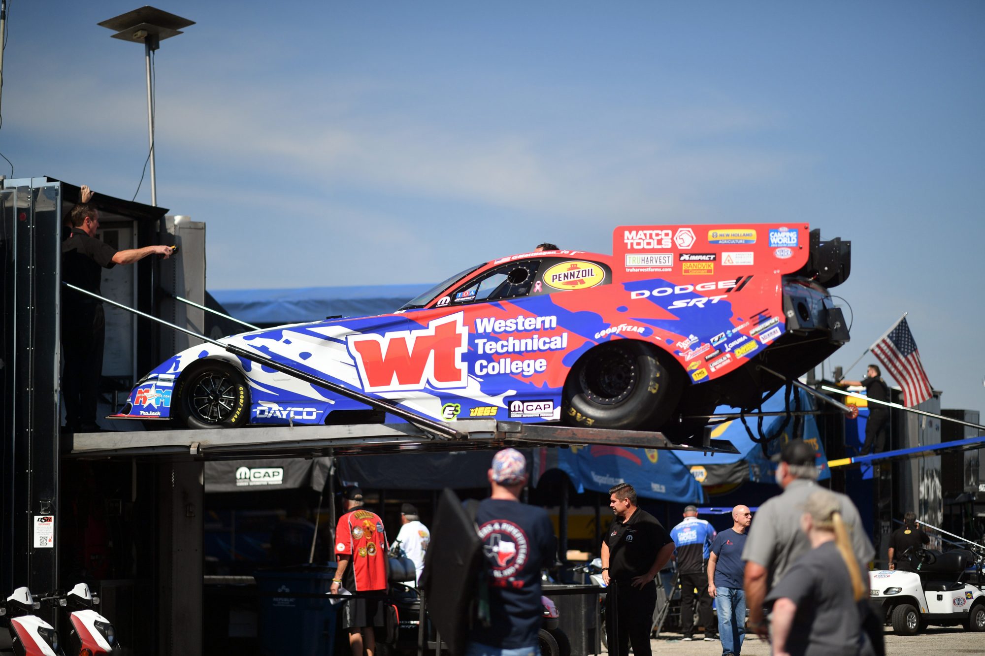 Matt Hagan's car coming off the trailer