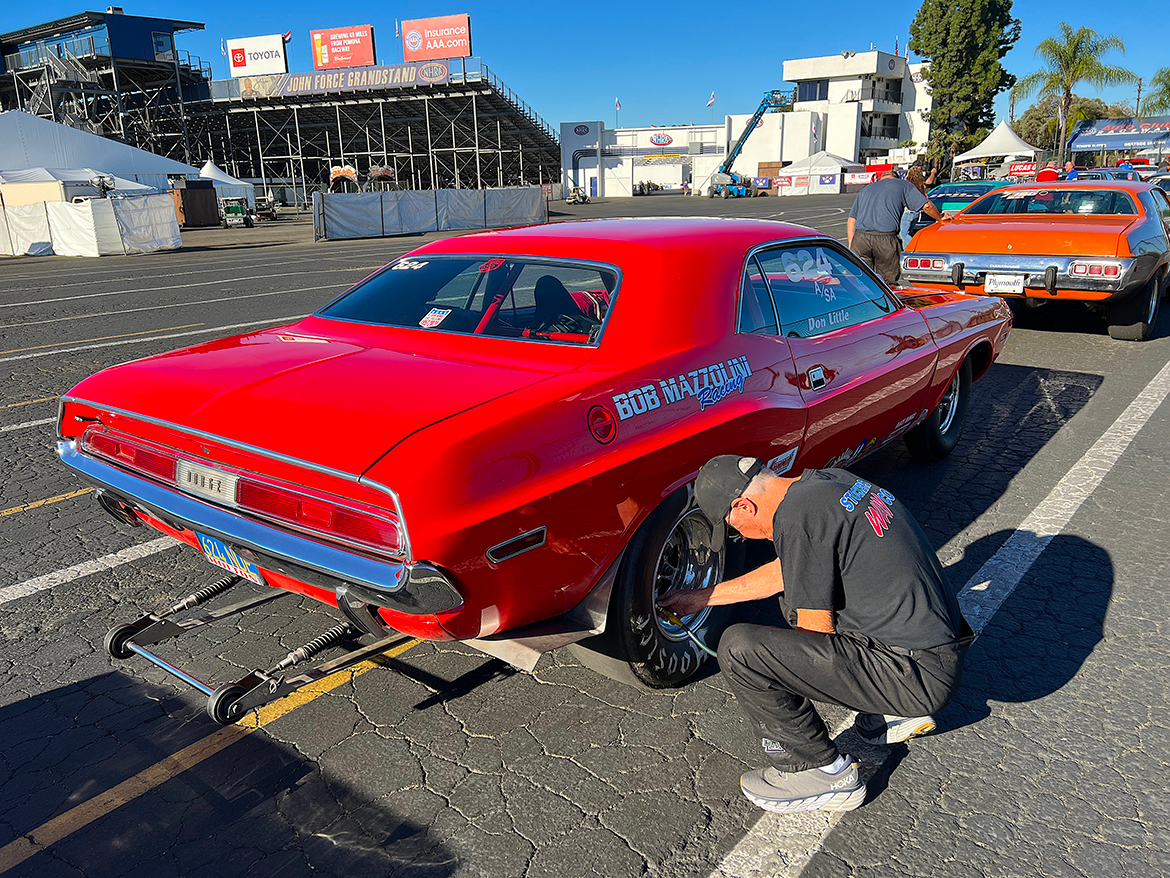 Man working on the wheel of vehicle