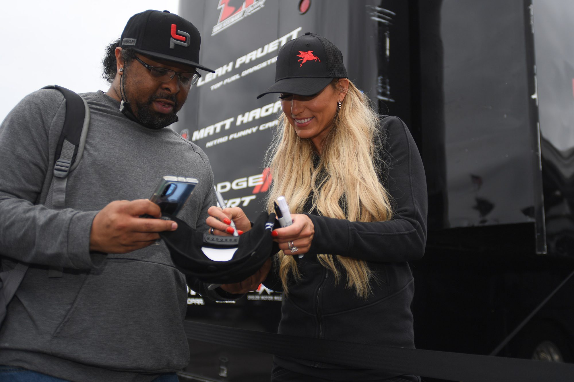 Leah signing an autograph