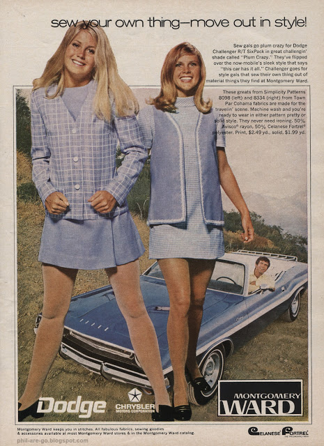 Two young women in 1960s-style blue outfits stand in front of a blue classic Dodge car parked on grass. A third woman, also in blue, sits on the car hood and smiles. The ad promotes Dodge and Montgomery Ward.