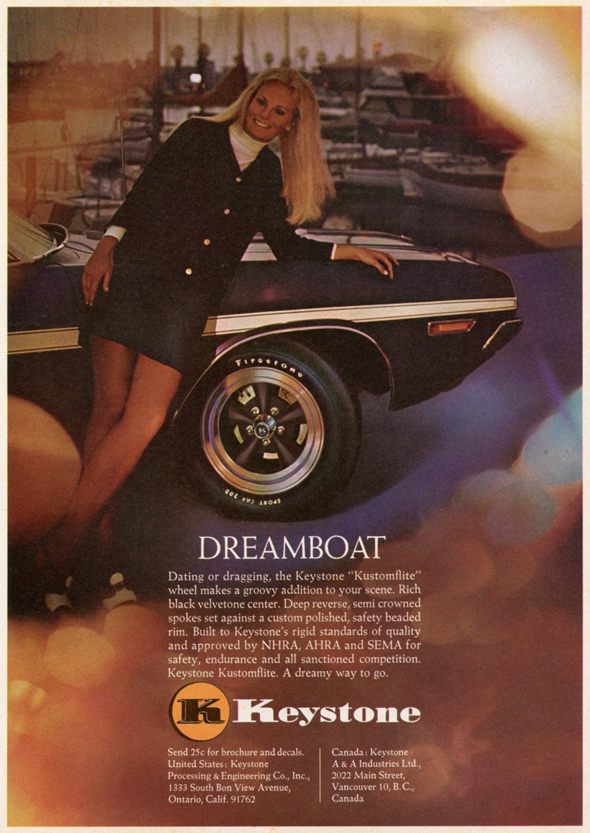 A woman in a dark dress and white blouse leans against a black classic car with shiny Keystone wheels. The image has a vintage, warm tone and includes a DREAMBOAT headline and text promoting Keystone wheels.